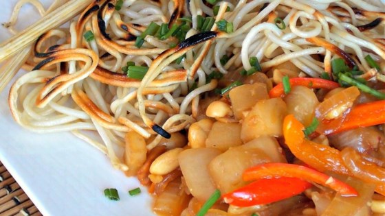 crispy chinese noodles with eggplant and peanuts