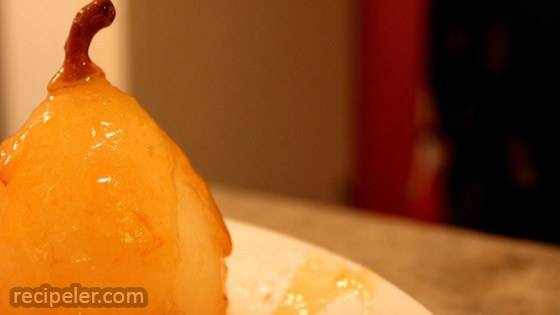 Flambeed Vanilla-Poached Pears with Apricot Sauce