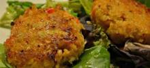 deviled crab cakes on mixed greens with ginger-citrus vinaigrette