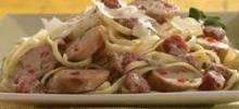 grilled sweet talian chicken sausage with tomato cream sauce over linguine