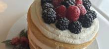 naked vanilla cake with mascarpone and berries