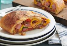 ham and sausage breakfast stromboli with roasted peppers and spinach