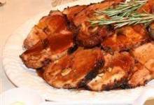 Rosemary-Scented Pork Loin Stuffed With Roasted Garlic, Dried Apricots and Cranberries and Port Wine Pan Sauce